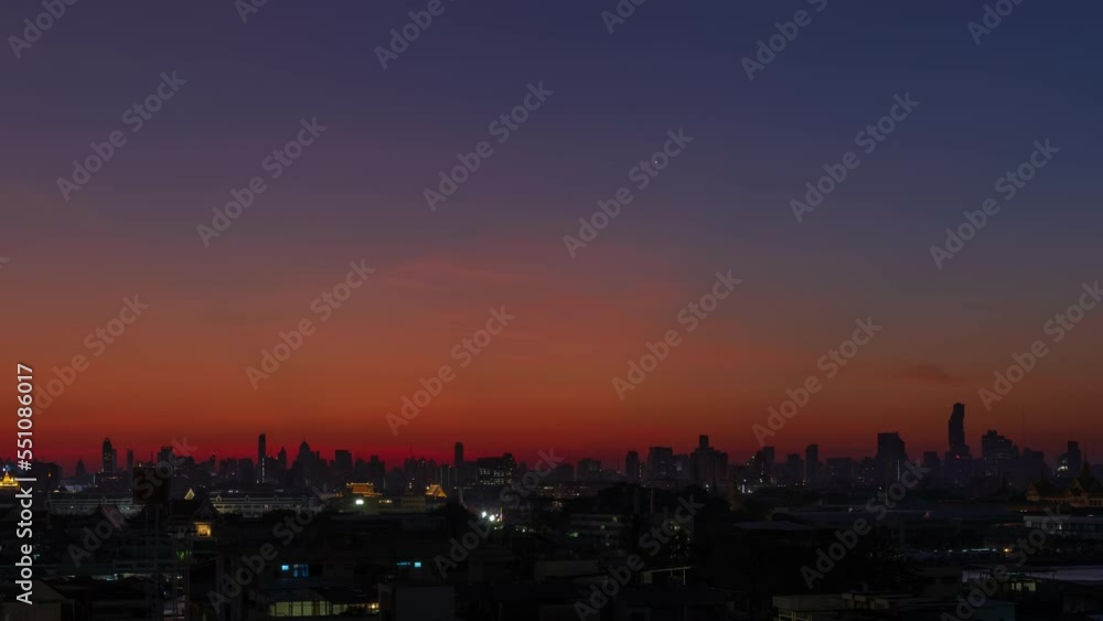 Dramatic sunrises over Bangkok downtown city center with Grand Palace and castle, night to day - time lapse Dramatic sunrises over Bangkok downtown city center with Grand Palace and castle, night to day - time lapse
