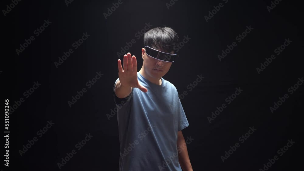 Asian Man Making Gestures With Hands In Air, Play 3D Video Game In Futuristic Goggles
Asian Man Making Gestures With Hands In Air, Play 3D Video Game In Futuristic Goggles