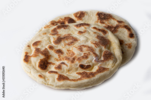 Turkish flat bread bazlama on white background
