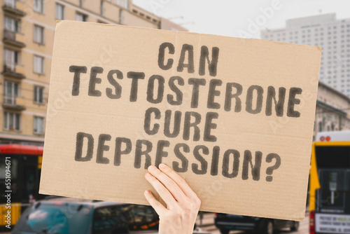 The question   Can testosterone cure depression    is on a banner in men s hands with blurred background. Stress. Bodybuilding. Metabolism. Deficiency. Diagnosis. Molecular. Mass. Research. Sex