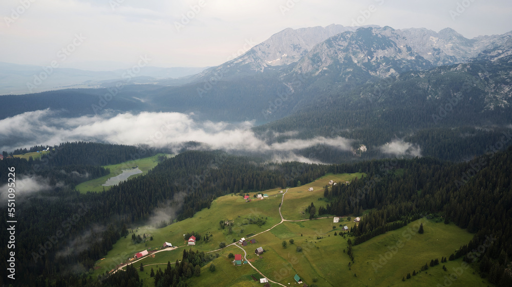 Aerial drone view of Zabljak in National Park Durmitor in Montenegro. Unesco protected area. Holidays and vacations in nature. Magical and foggy landscape. 
