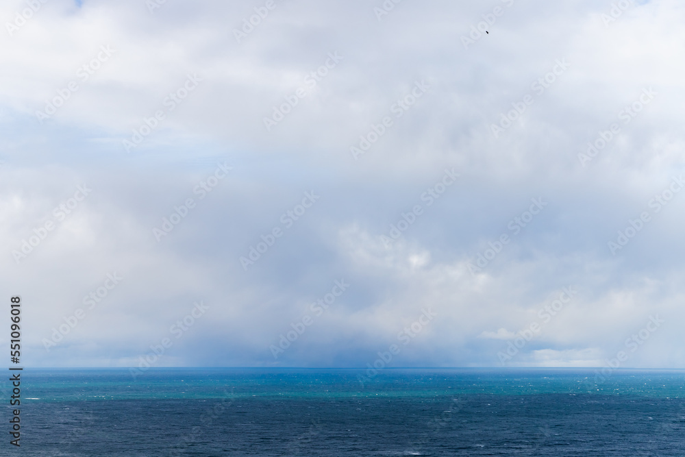 Blue Baltic Sea water is under cloudy sky on a c cloudy day