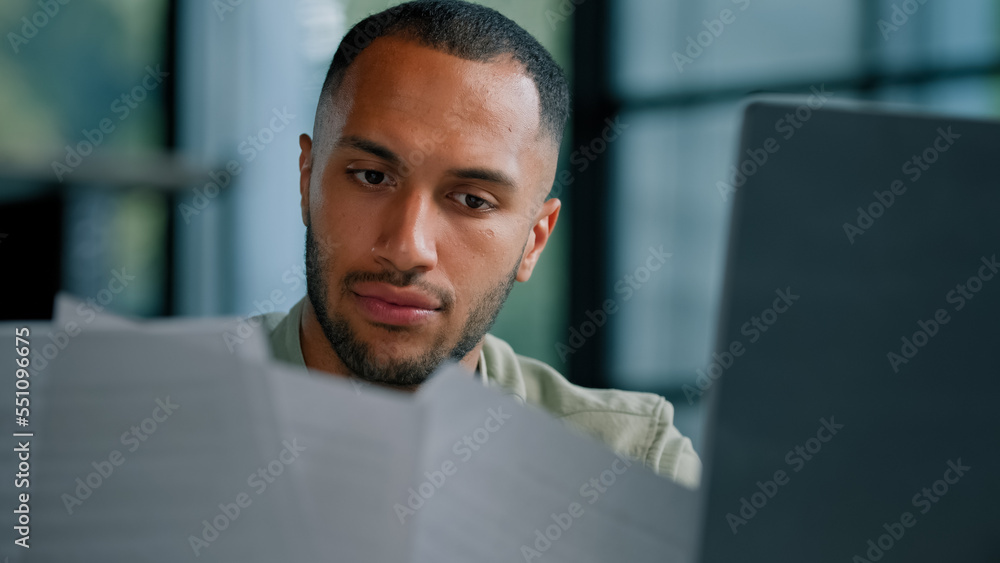 Serious pensive thinking African Latina businessman boss auditor checking corporate paperwork correspondence male entrepreneur reading documents think check problem analyzing financial papers audit Serious pensive thinking African Latina businessman boss auditor checking corporate paperwork correspondence male entrepreneur reading documents think check problem analyzing financial papers audit