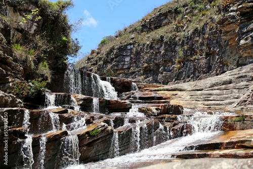 Creek waterfalls between rocks and vegetation. Region of Concei  ao de Mato Dentro in Minas Gerais  Brazil