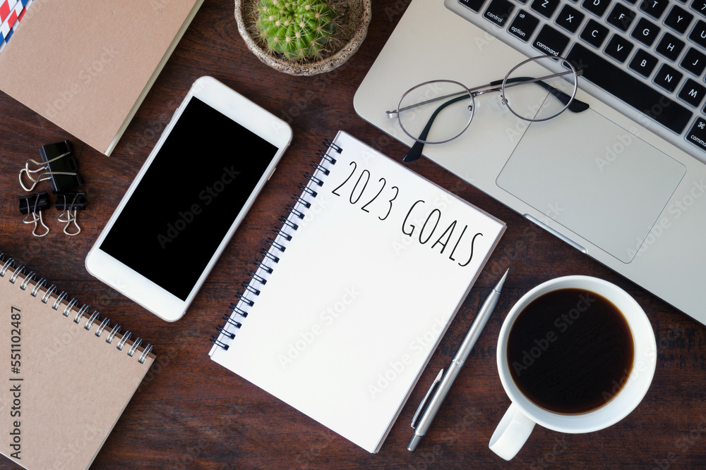 Notebook with 2023 goals text on it to apply new year resolutions and plan. Notebook with 2023 goals text on it to apply new year resolutions and plan.
