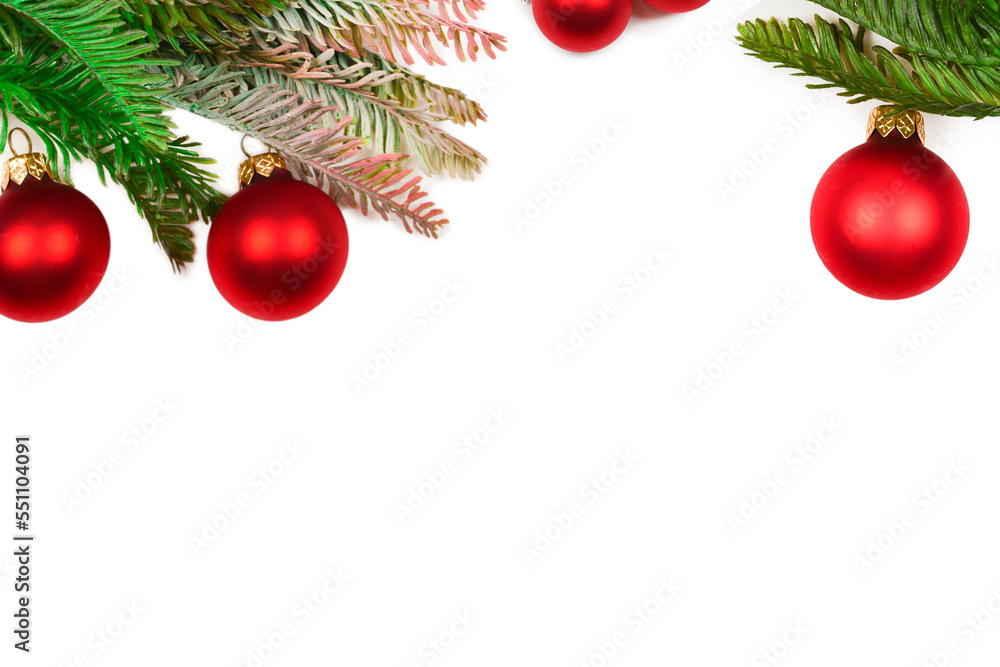 A sprig of spruce decorated with red сhristmas ball isolated on white. A sprig of spruce decorated with red сhristmas ball isolated on white.