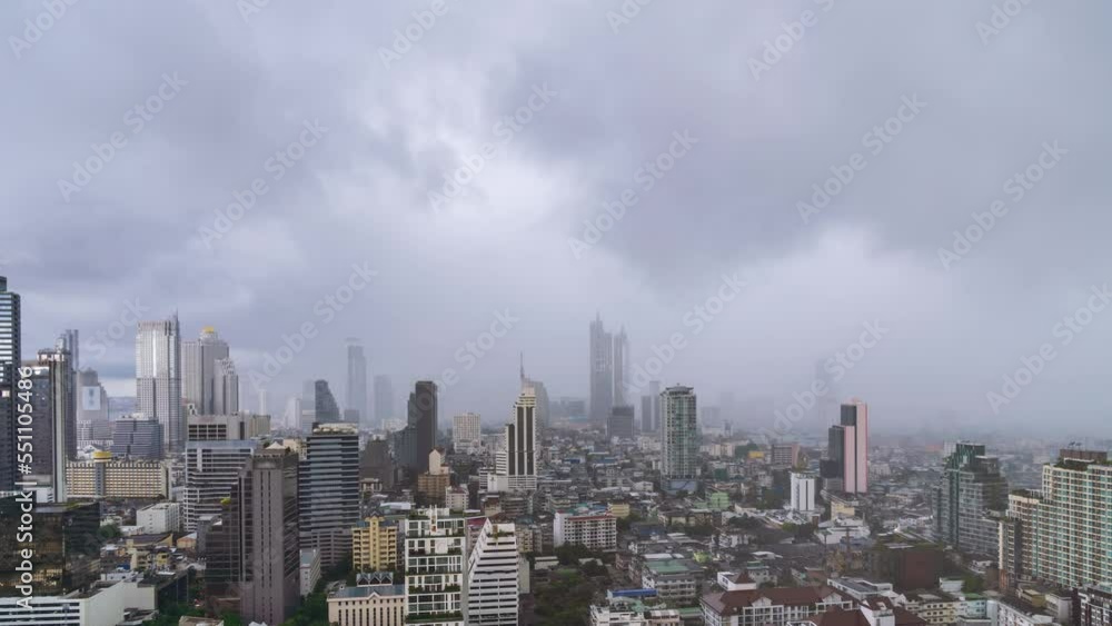 Bangkok business district city center with buildings and skyscrapers during rain or rainstorm, zoom out - Time Lapse Bangkok business district city center with buildings and skyscrapers during rain or rainstorm, zoom out - Time Lapse