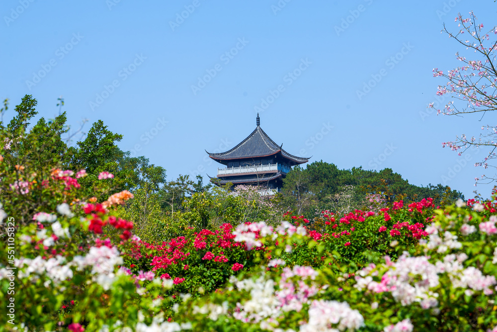 Chinese style ancient buildings among flowers outdoors Chinese style ancient buildings among flowers outdoors