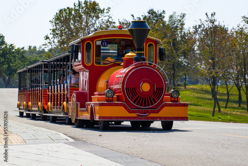 A small train for commuting in the park