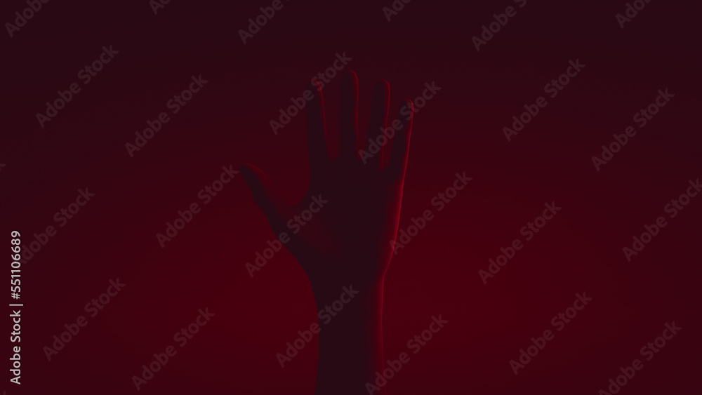 Raised human hand. Close-up. Red backlight.