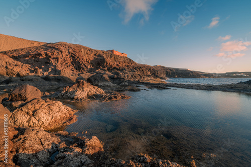 Large puddle on the coast of Galdar at sunset. Gran Canaria. Canary Islands