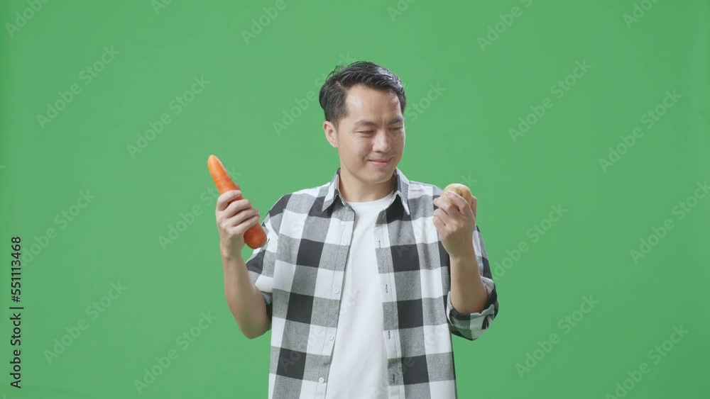 Asian Male Farmer Holding Potato And Carrot While Warmly Smiling On Green Screen Background In The Studio
Asian Male Farmer Holding Potato And Carrot While Warmly Smiling On Green Screen Background In The Studio