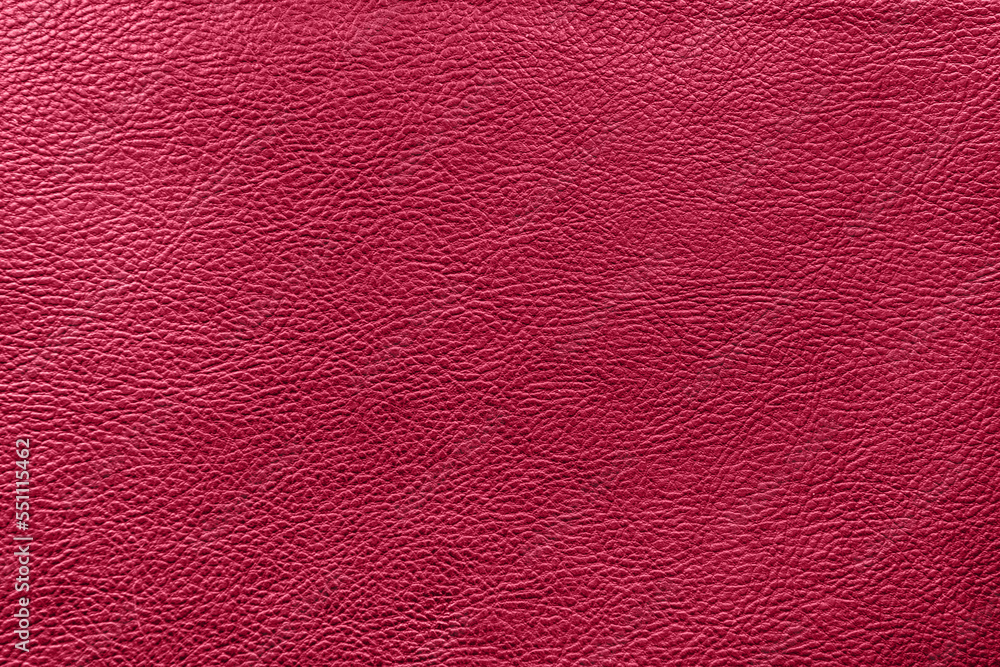 Fototapeta premium Viva Magenta color leather texture. Abstract background. Trending color of 2023 - Viva Magenta.