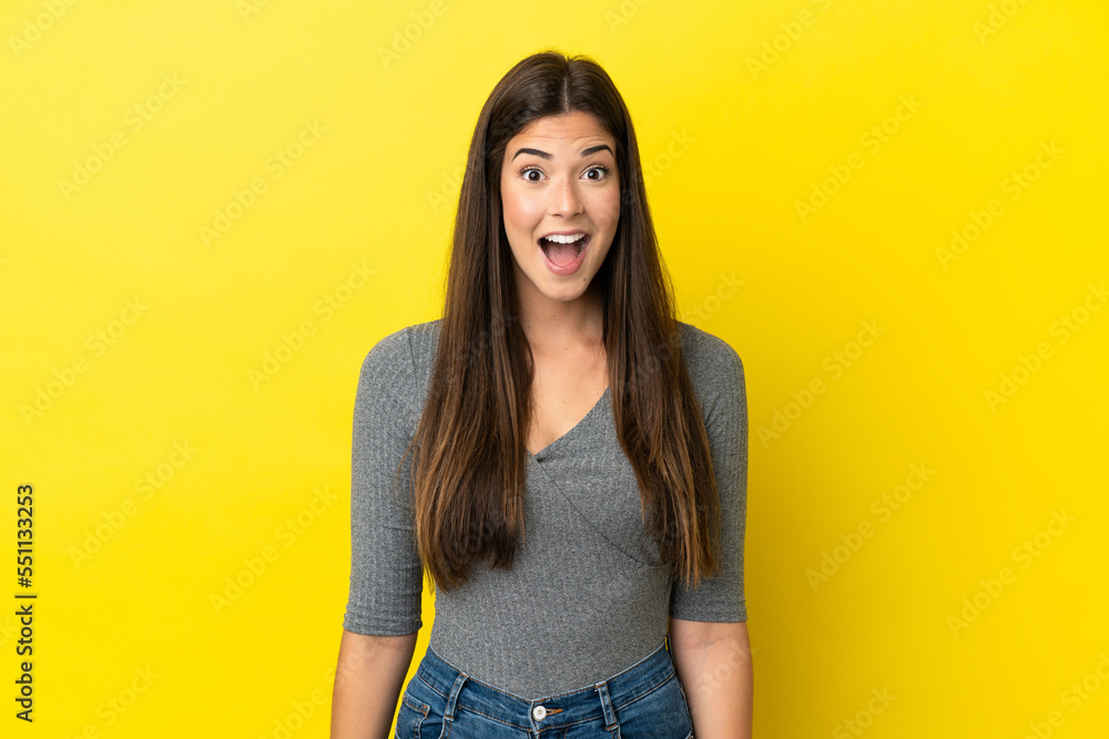 Young Brazilian woman isolated on yellow background with surprise facial expression Young Brazilian woman isolated on yellow background with surprise facial expression