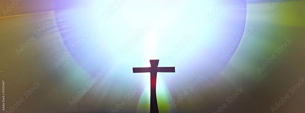 Silhouette of cross at with holy light