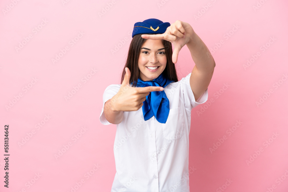 Airplane stewardess Brazilian woman isolated on pink background focusing face. Framing symbol Airplane stewardess Brazilian woman isolated on pink background focusing face. Framing symbol