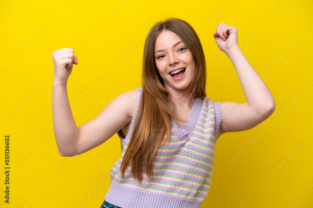 Young caucasian woman isolated on yellow background celebrating a victory Young caucasian woman isolated on yellow background celebrating a victory