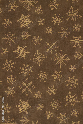 Brown and gold snowflake winter background