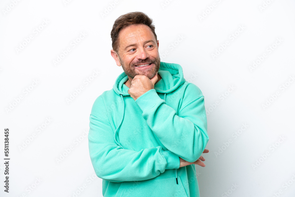 Middle age caucasian man isolated on white background looking to the side and smiling Middle age caucasian man isolated on white background looking to the side and smiling