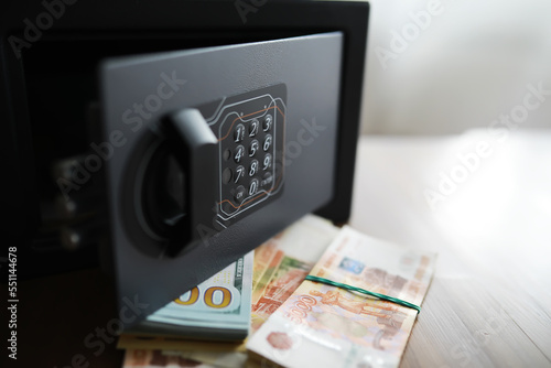 money in a residential safe close-up photo. Deposit in cash. Russian rubles are in the safe