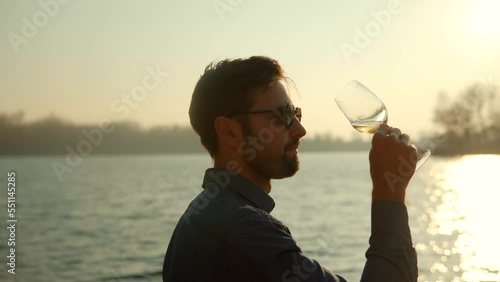 winegrower drink white wine. winemaker testing wine in glassg 