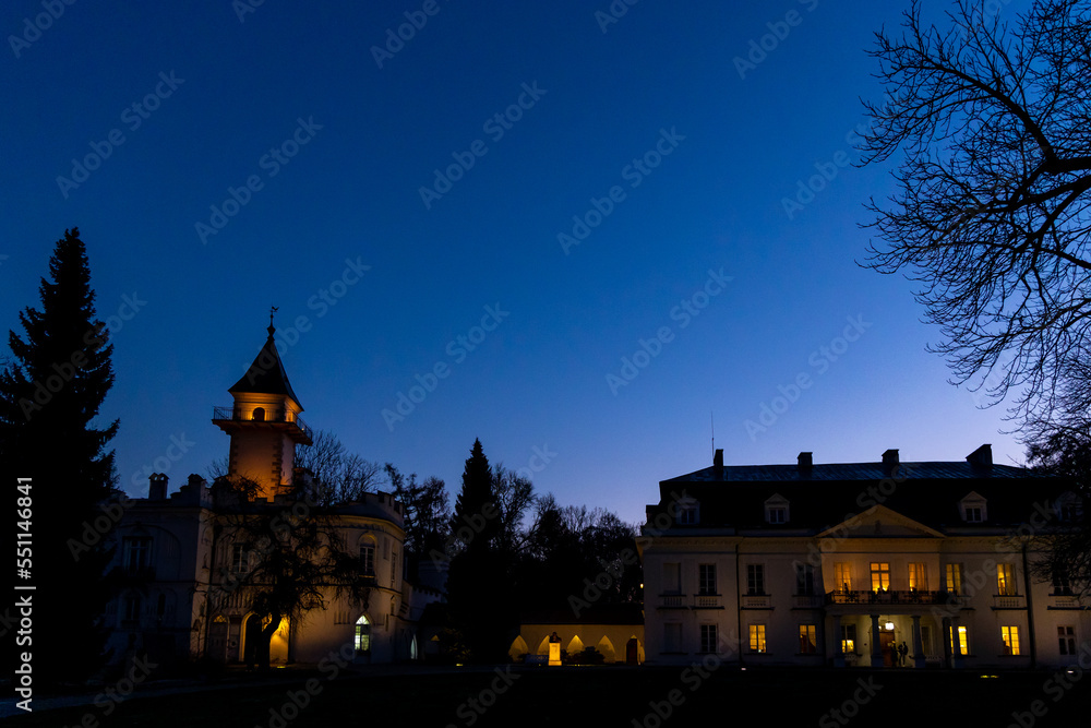 Colorful dramatic sky during sunset over the old palace. Deep blue gradient sky over the building. Colorful dramatic sky during sunset over the old palace. Deep blue gradient sky over the building.