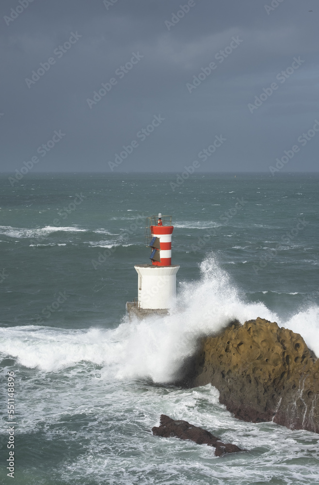 Rough sea and waves over the lighthouse of Pasaia, Euskadi