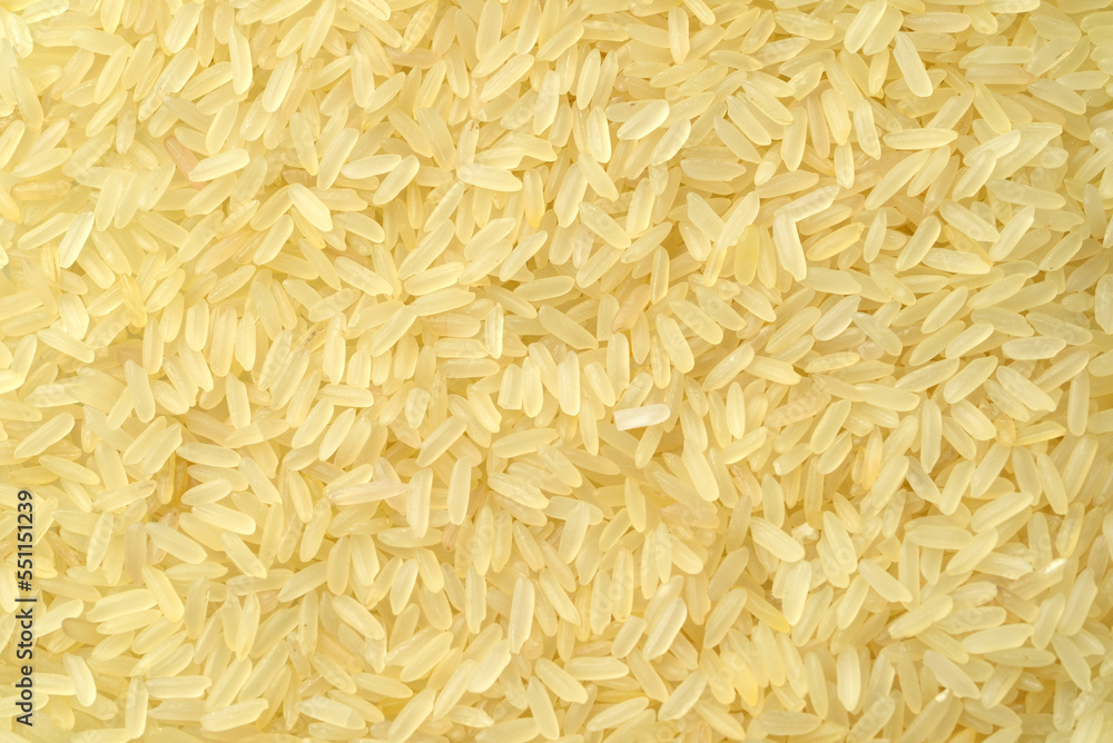 Raw uncooked rice texture background, rice macro shot Raw uncooked rice texture background, rice macro shot