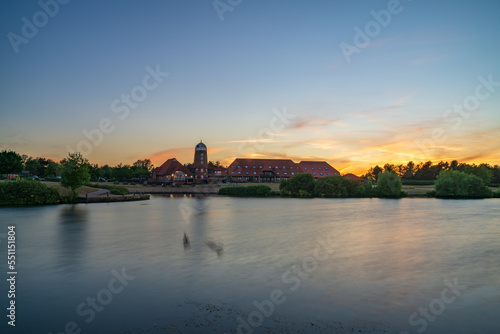 Caldecotte lake old windmill at sunset