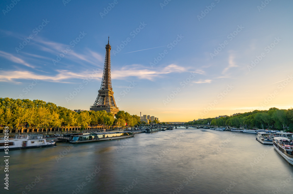 Fototapeta premium Sunset view of Eiffel tower and Seine river in Paris, France