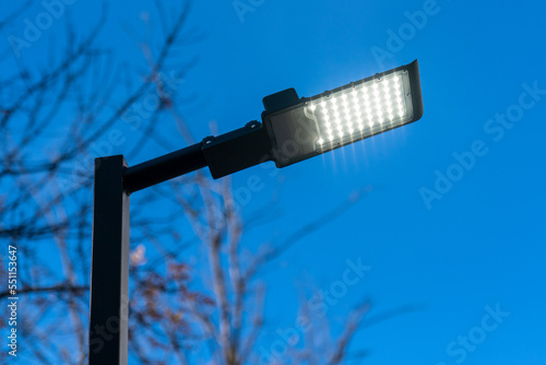 Modern LED city lamp. Street LED lamp. A lit street lamp.