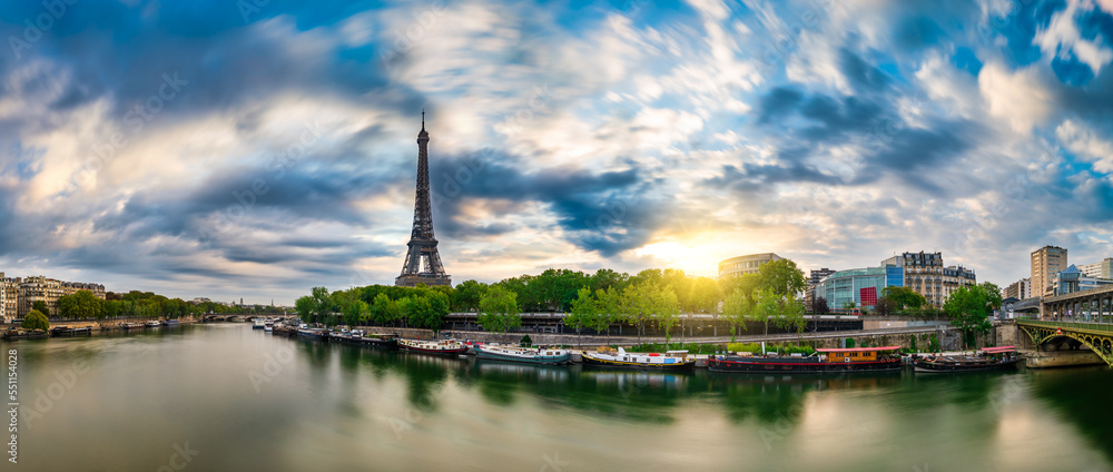 Fototapeta premium Eiffel Tower by seine river at sunrise in Paris. France