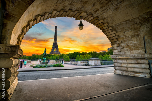 Eiffel Tower at sunrise seen from Bir-Hakeim bridge in Paris, France