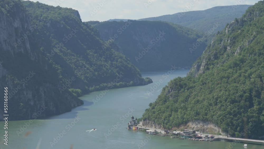 Danube gorge through Carpathian Mountains with Mraconia Monastery on river bank Danube gorge through Carpathian Mountains with Mraconia Monastery on river bank