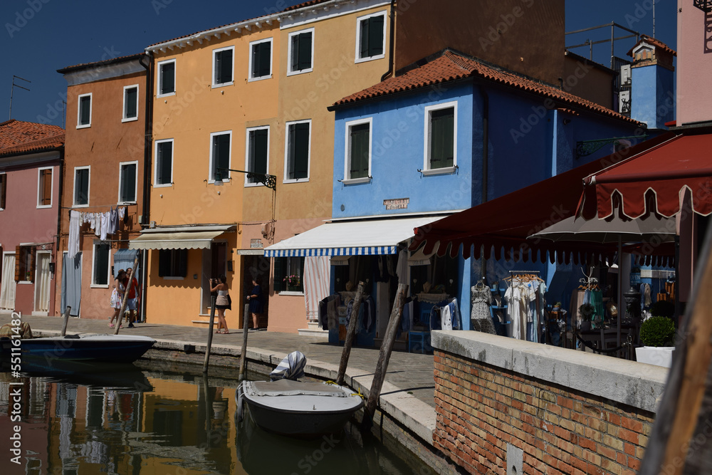 bright colored houses in Burano, on a canal