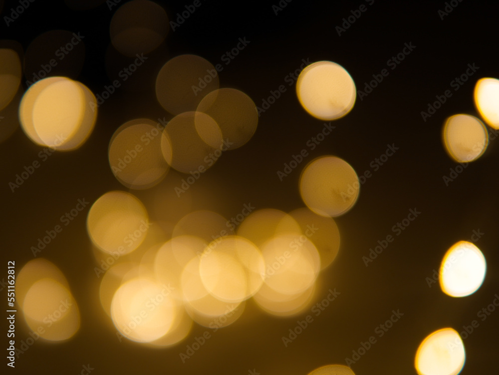 Golden and dark brown round bokeh lights festive background Golden and dark brown round bokeh lights festive background