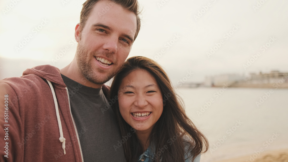 Laughing couple talking on video call Laughing couple talking on video call