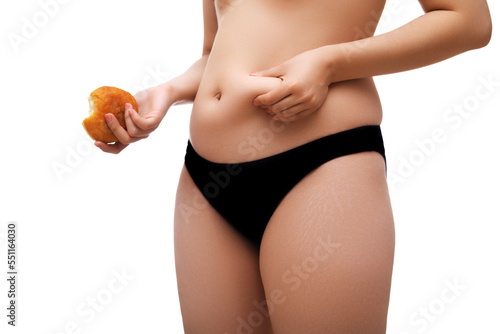 Εκτύπωση καμβά The girl tightens the skin on her stomach , showing fat deposits in the abdomen and sides