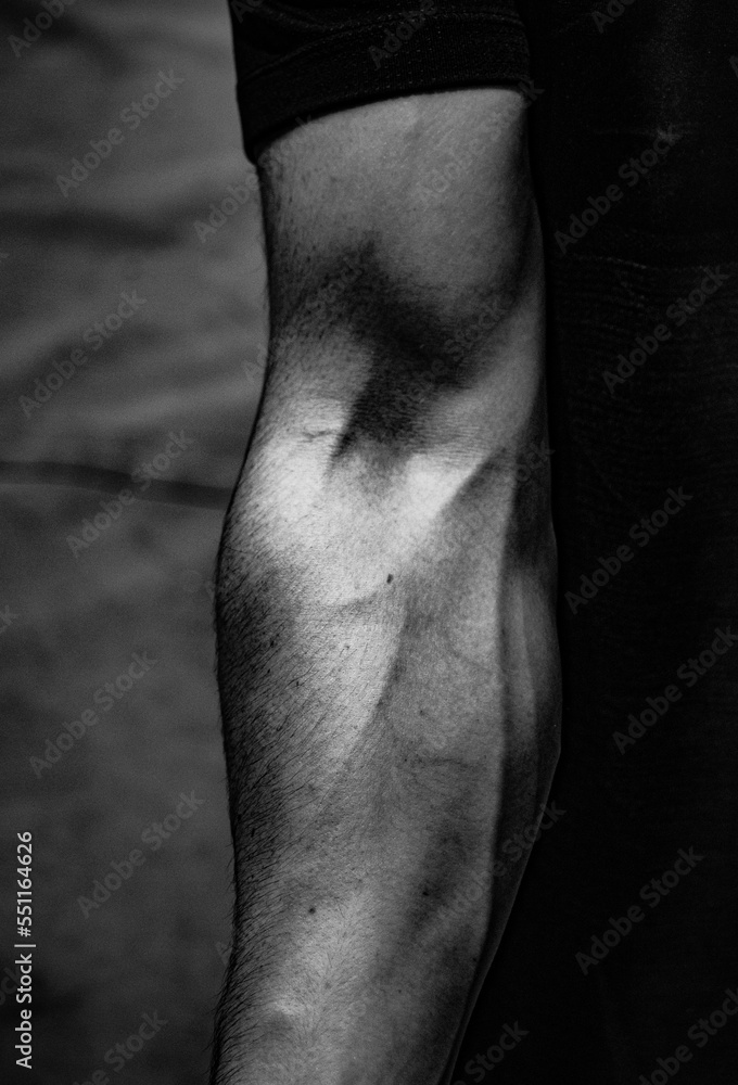 Arm of a muscular climber Contraction of the biceps and triceps Stock