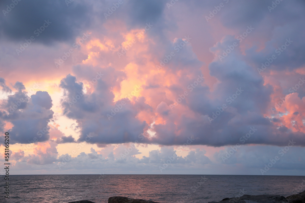 Picturesque view of sky with heavy rainy clouds over sea