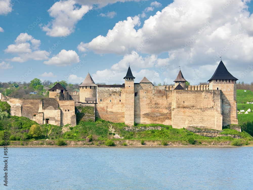 Spring view of Khotyn Fortress on Dniester riverside (Chernivtsi Oblast, Ukraine). Construction was started in 1325, while major improvements were made in the 1380s and in the 1460s.