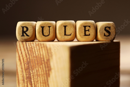 Photography Word Rules made of cubes with letters on wooden block, closeup