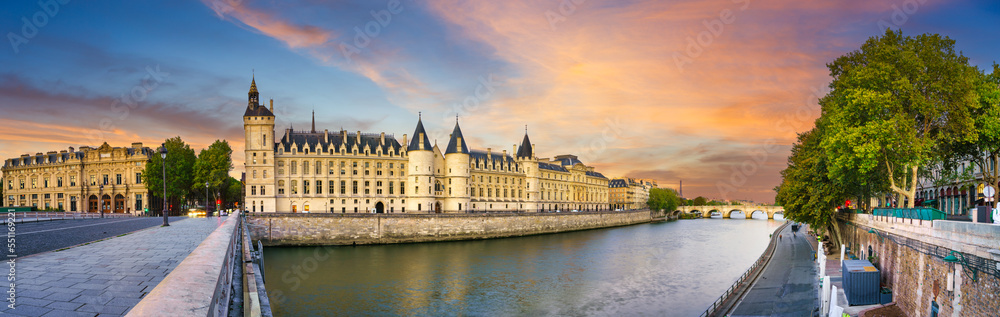 The Conciergerie palace and prison by the Seine river at sunrise in Paris. France