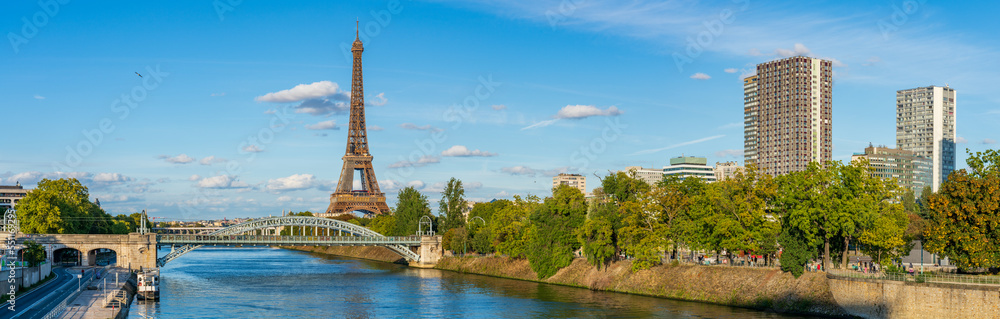 Eiffel Tower by seine river in autumn season in Paris. France