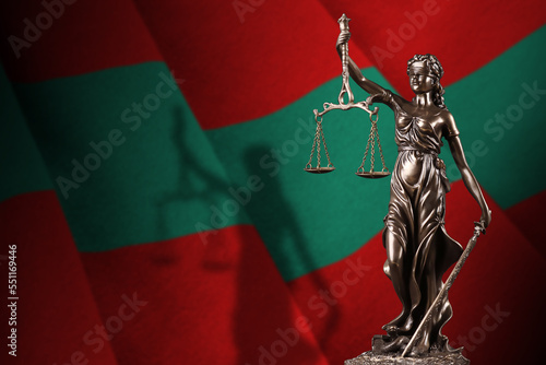 Transnistria flag with statue of lady justice and judicial scales in dark room. Concept of judgement and punishment, background for jury topics