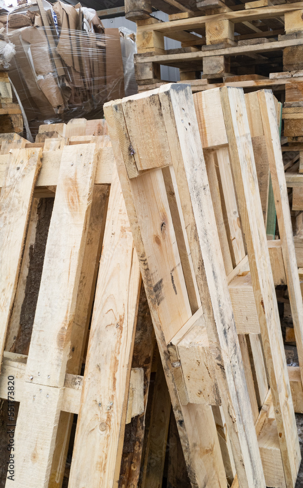A lot of stacked wooden pallets A lot of stacked wooden pallets