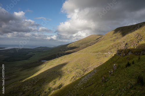  view of Conor Pass, one of the highest Irish mountain passes served by an asphalted road, located on the south-western end of the Dingle Peninsula, County Kerry, Ireland photo