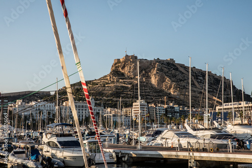Boats in the marina of Alicante with the castle of Santa Barbara in the background