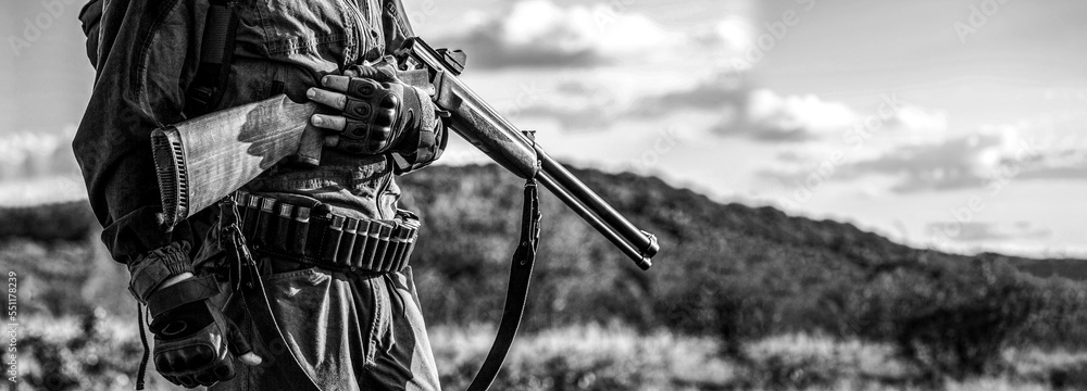 Man is on the hunt. Hunter man. Hunting period, autumn season. Black