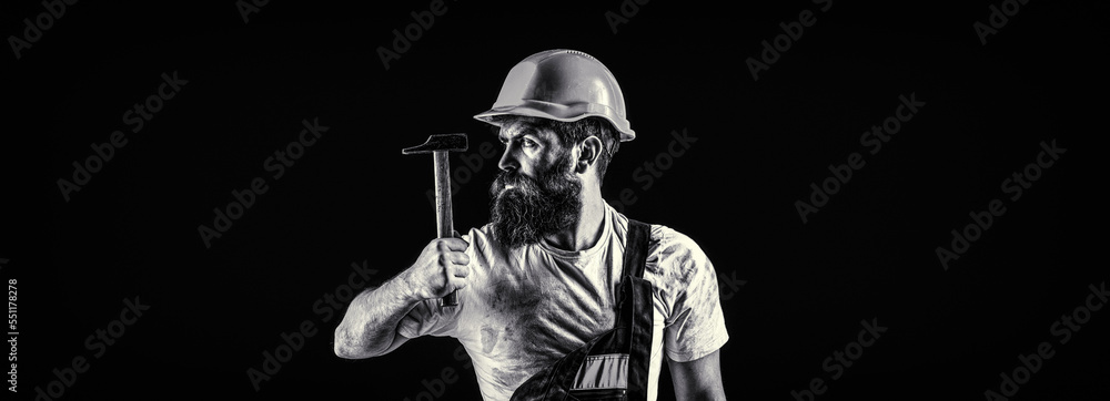 Bearded man worker with beard, building helmet, hard hat. Hammer hammering. Builder in helmet, hammer, handyman, builders in hardhat. Black and white Bearded man worker with beard, building helmet, hard hat. Hammer hammering. Builder in helmet, hammer, handyman, builders in hardhat. Black and white